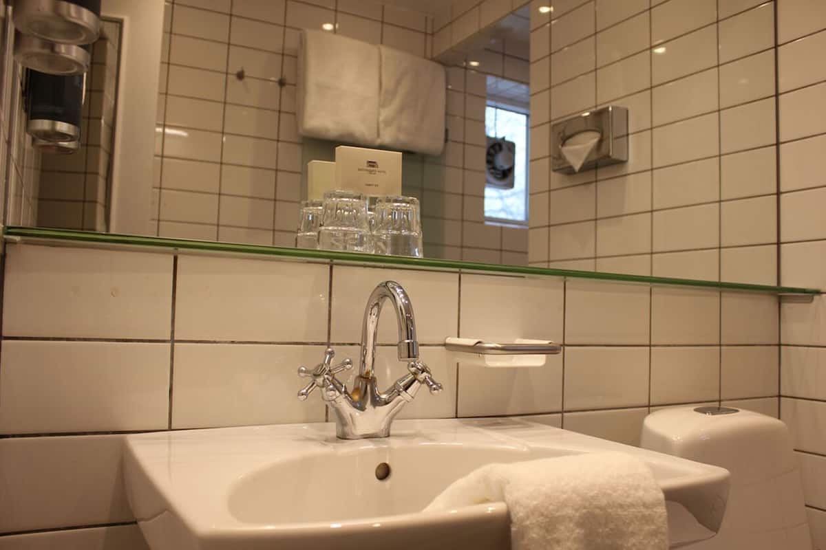 shower, designer toiletries, hair dryer, towels