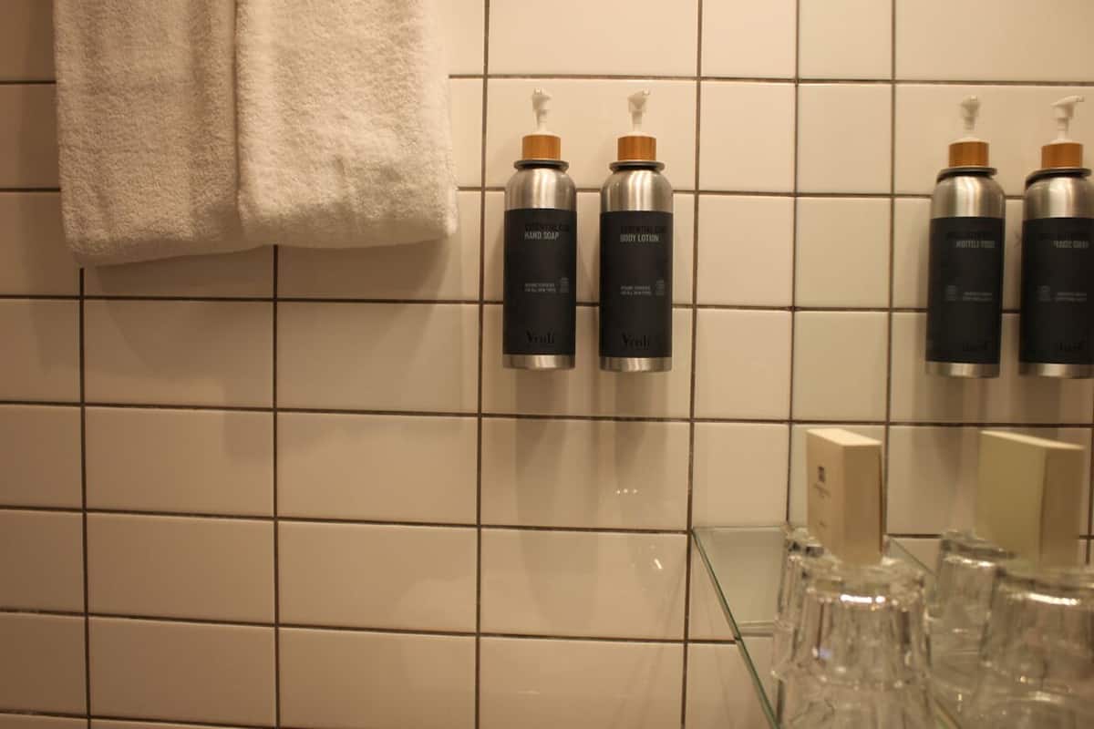 shower, designer toiletries, hair dryer, towels