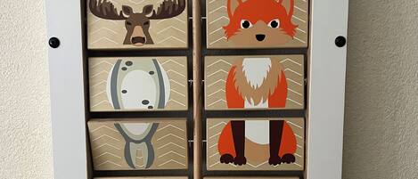 A wall-mounted display with animal illustrations.