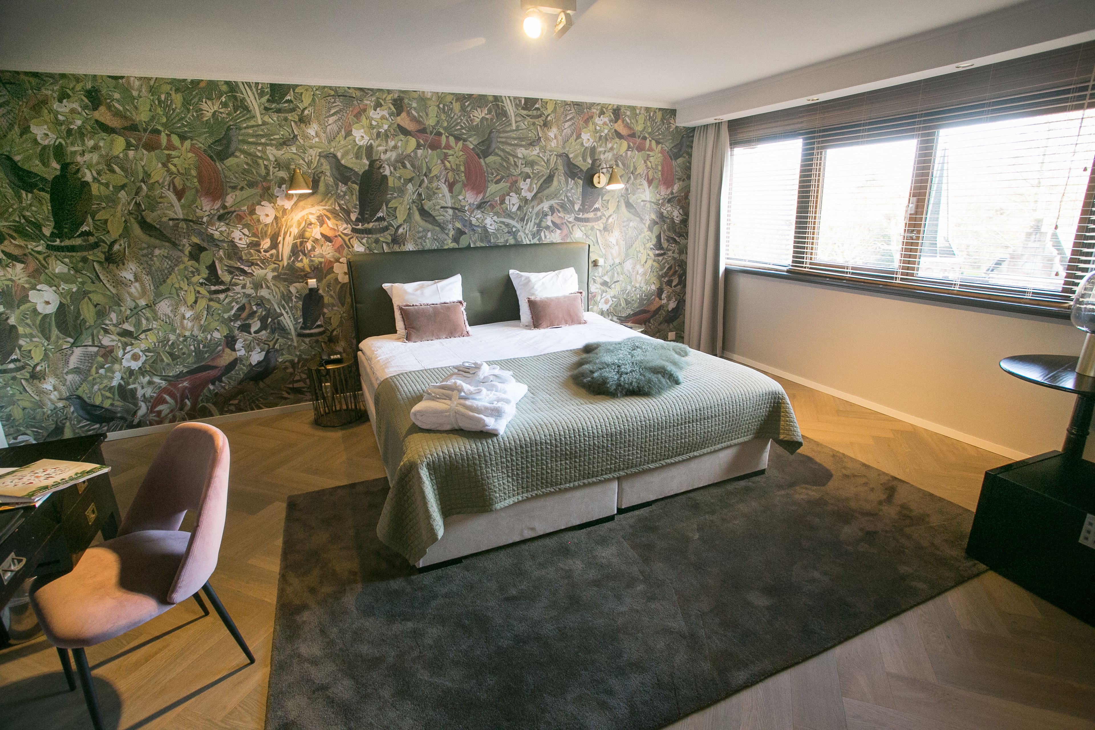 honeymoon suite, 1 king bed, garden view | in-room safe, desk, laptop workspace, iron/ironing board