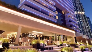 A modern hotel with a rooftop terrace featuring outdoor seating and planters. - Grosvenor House, a Luxury Collection Hotel, Dubai (Dubai)