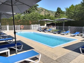 Seasonal outdoor pool, open 10:30 AM to 5:30 PM, pool umbrellas