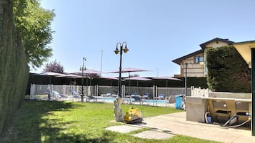 Seasonal outdoor pool, open 10:30 AM to 5:30 PM, pool umbrellas