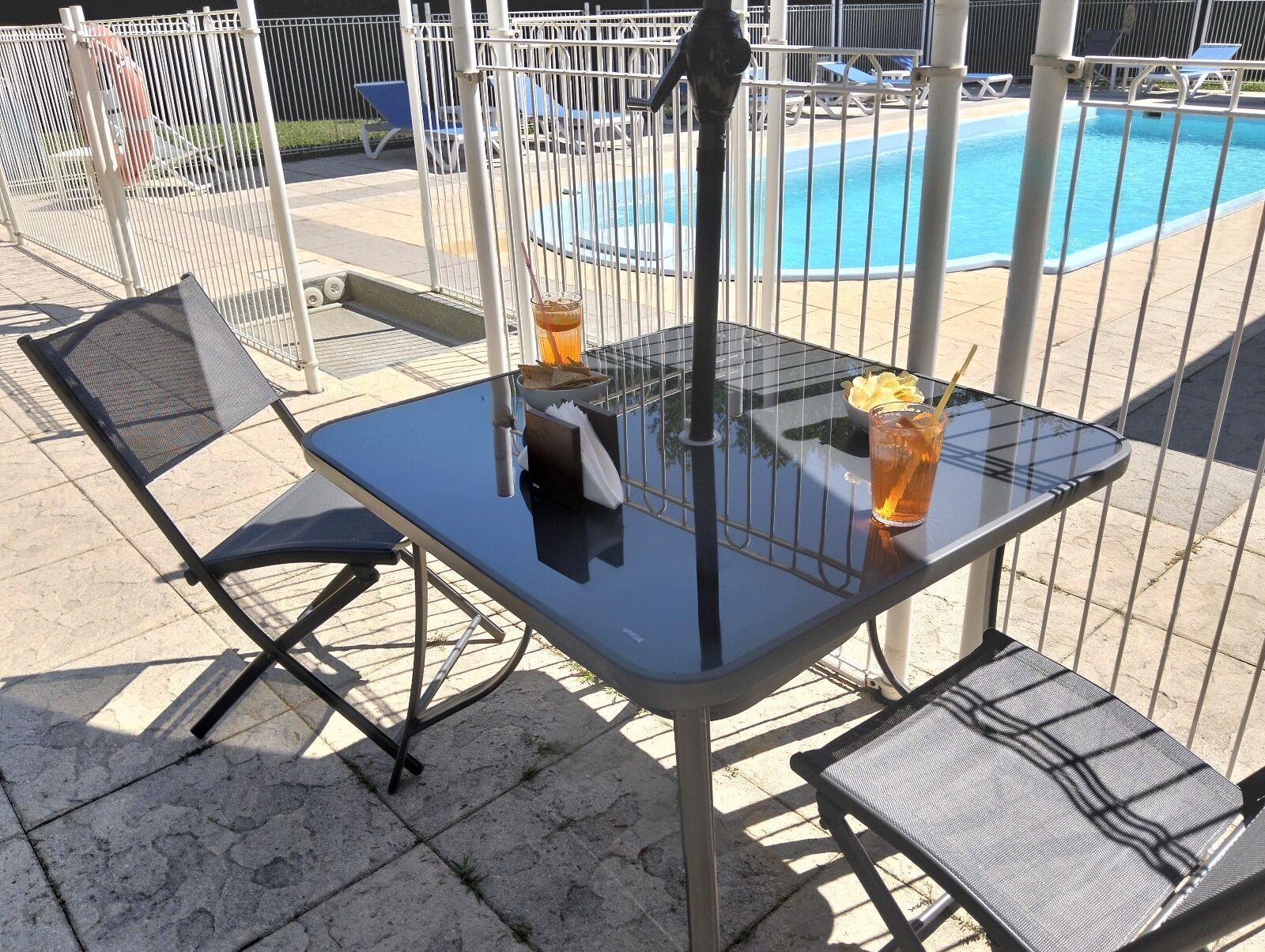 seasonal outdoor pool, open 10:30 am to 5:30 pm, pool umbrellas