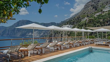 Indoor pool, outdoor pool, open 9:00 AM to 6:00 PM, pool umbrellas