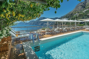 Indoor pool, outdoor pool, open 9:00 AM to 6:00 PM, pool umbrellas