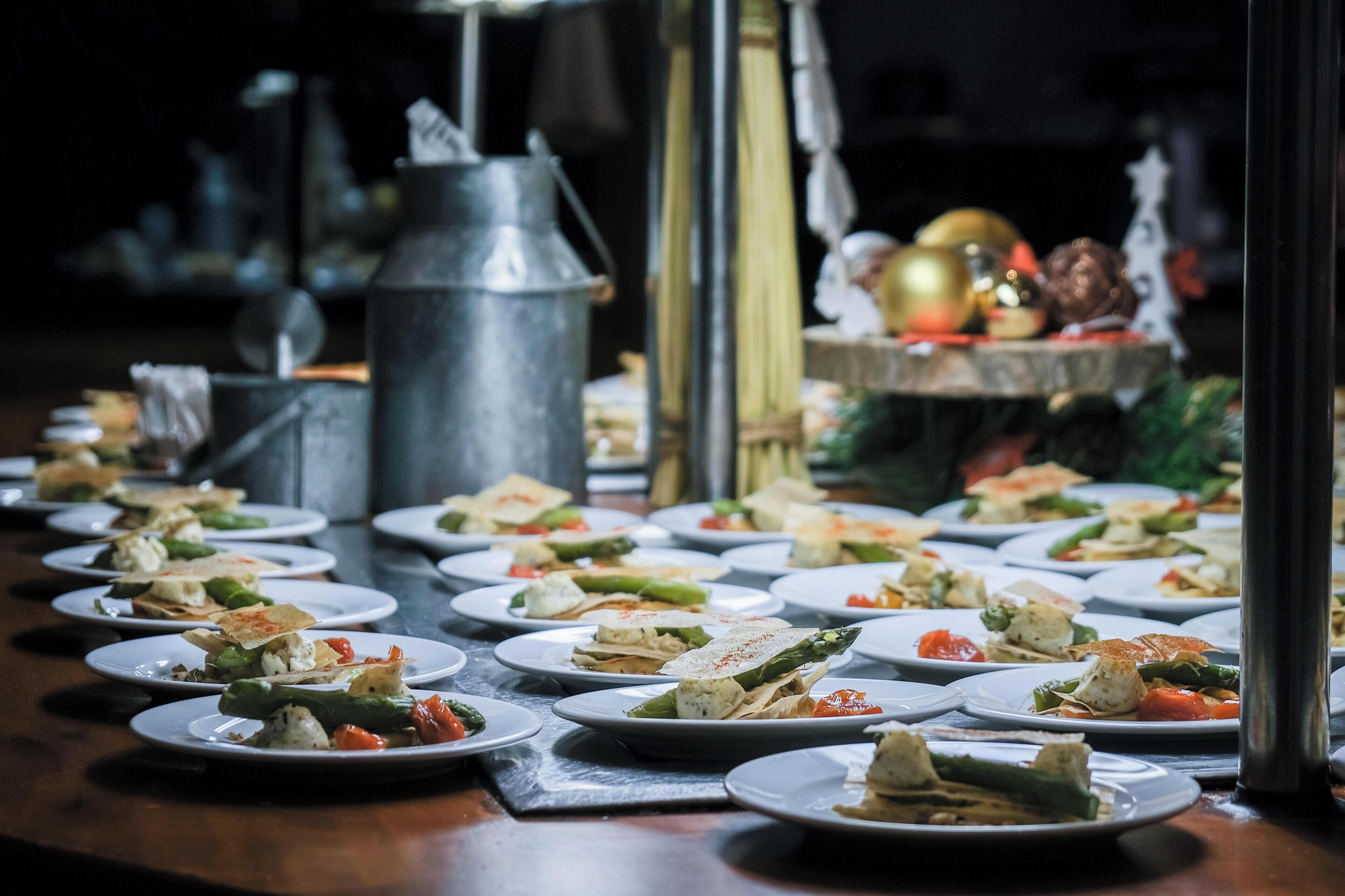 A buffet table with various dishes.
