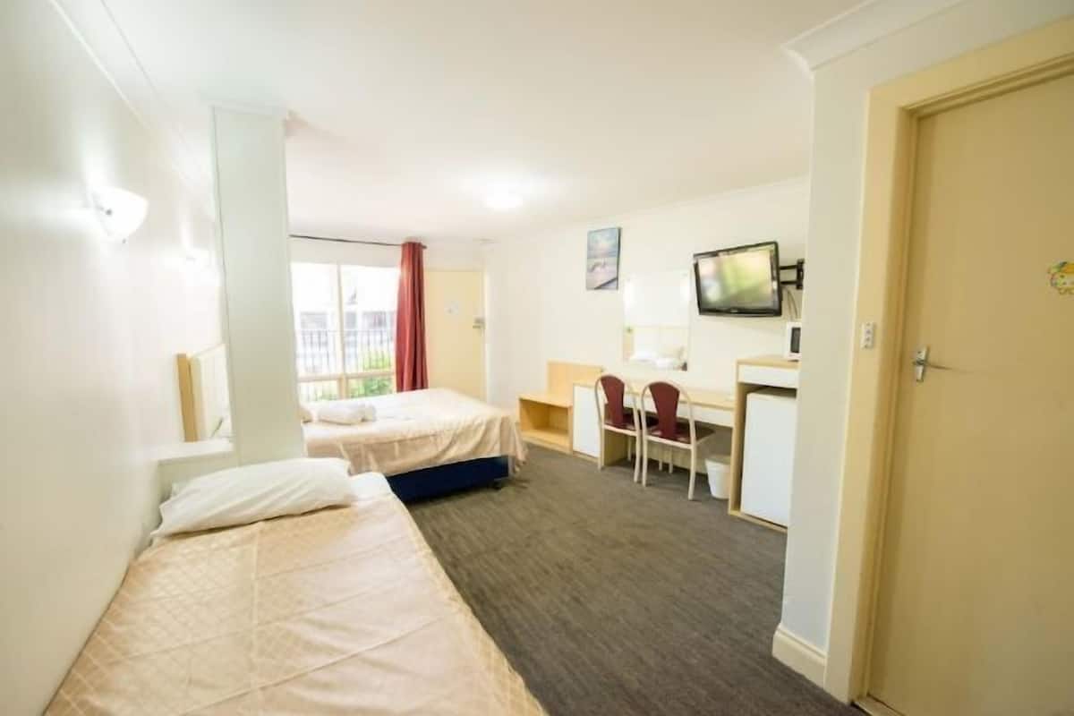 Desk, laptop workspace, free WiFi, bed sheets