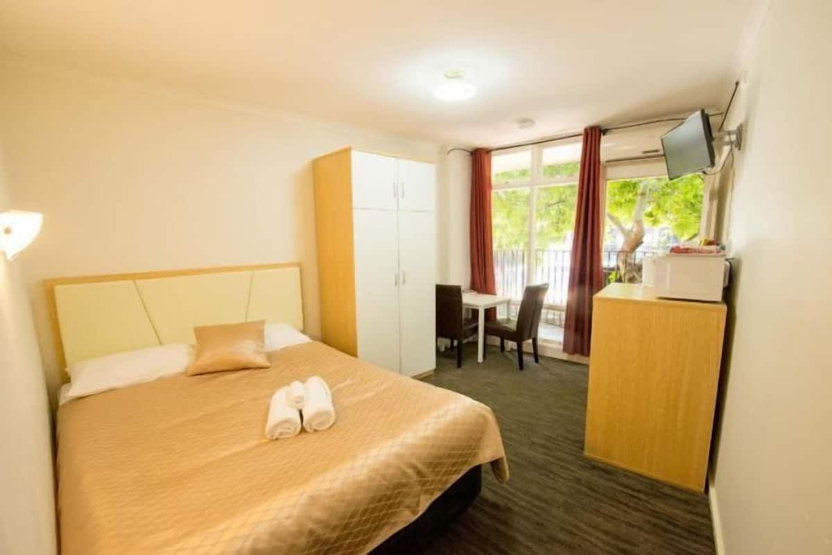 Desk, laptop workspace, free WiFi, bed sheets