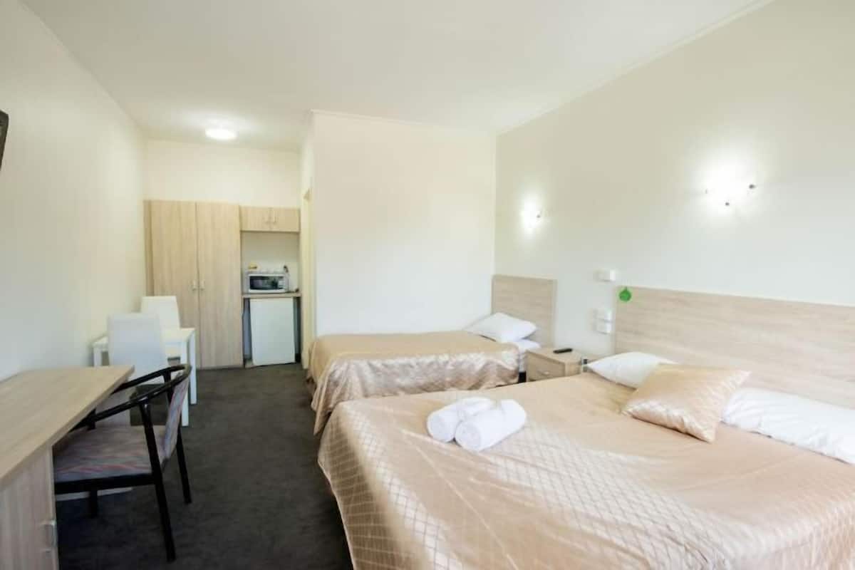 Desk, laptop workspace, free WiFi, bed sheets