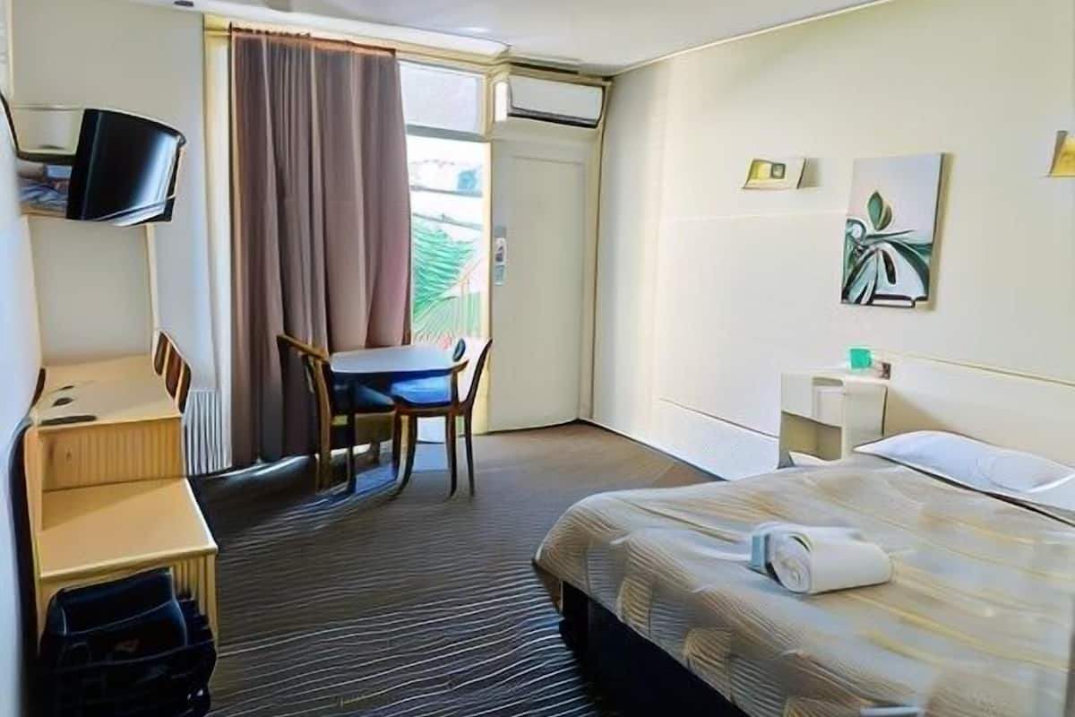 Desk, laptop workspace, free WiFi, bed sheets