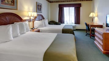 Desk, iron/ironing board, bed sheets