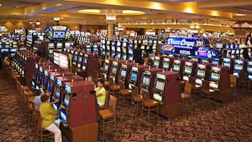 A casino with multiple slot machines arranged in rows.