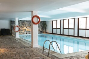 Indoor pool, open 10 AM to 8 PM, pool loungers