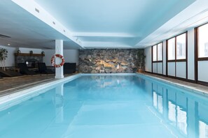 Indoor pool, open 10 AM to 8 PM, pool loungers