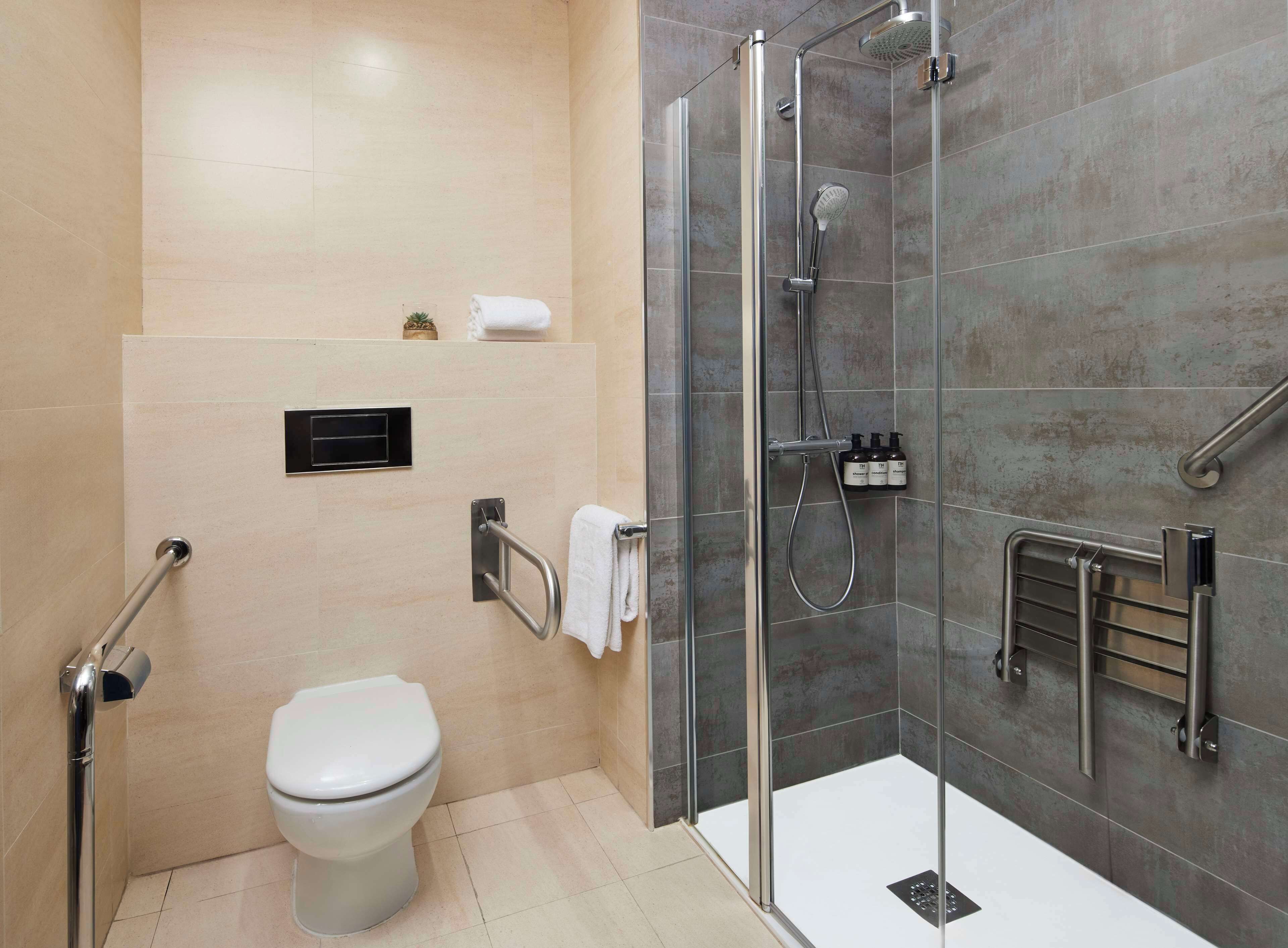 superior room | bathroom | bathtub, eco-friendly toiletries, hair dryer, towels