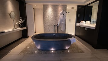 Suite, Garden Area | Bathroom | Rainfall showerhead, free toiletries, hair dryer, towels