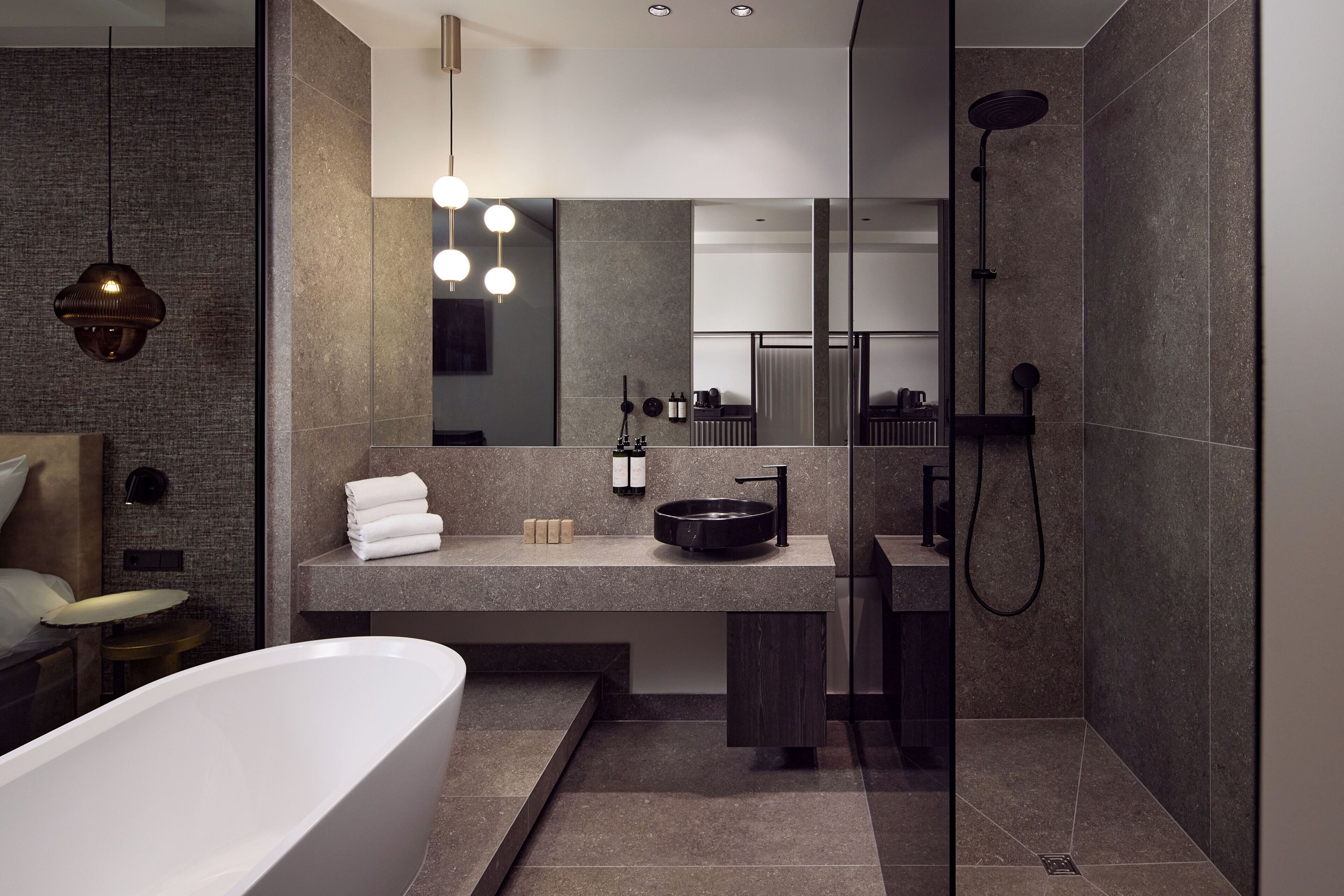 deluxe double room | bathroom | rainfall showerhead, free toiletries, hair dryer, towels