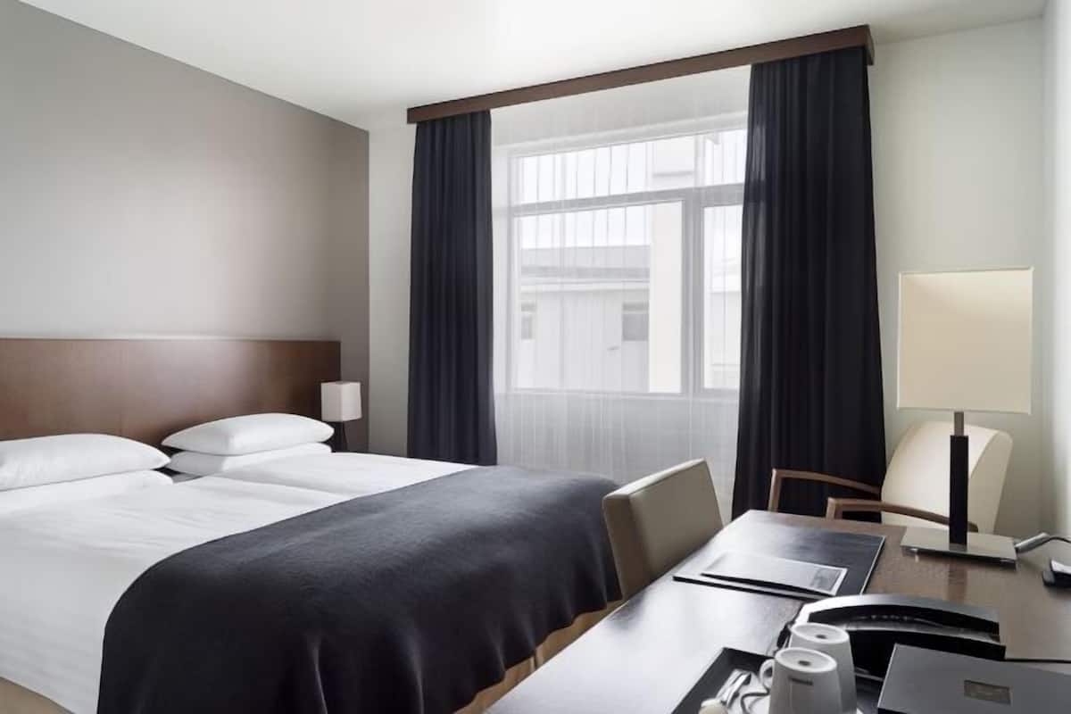 Hypo-allergenic bedding, down duvets, in-room safe, desk
