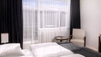 Hypo-allergenic bedding, down duvets, in-room safe, desk