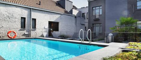 Seasonal outdoor pool, pool loungers