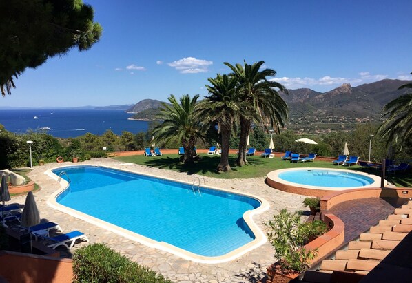 2 outdoor pools, pool umbrellas, pool loungers