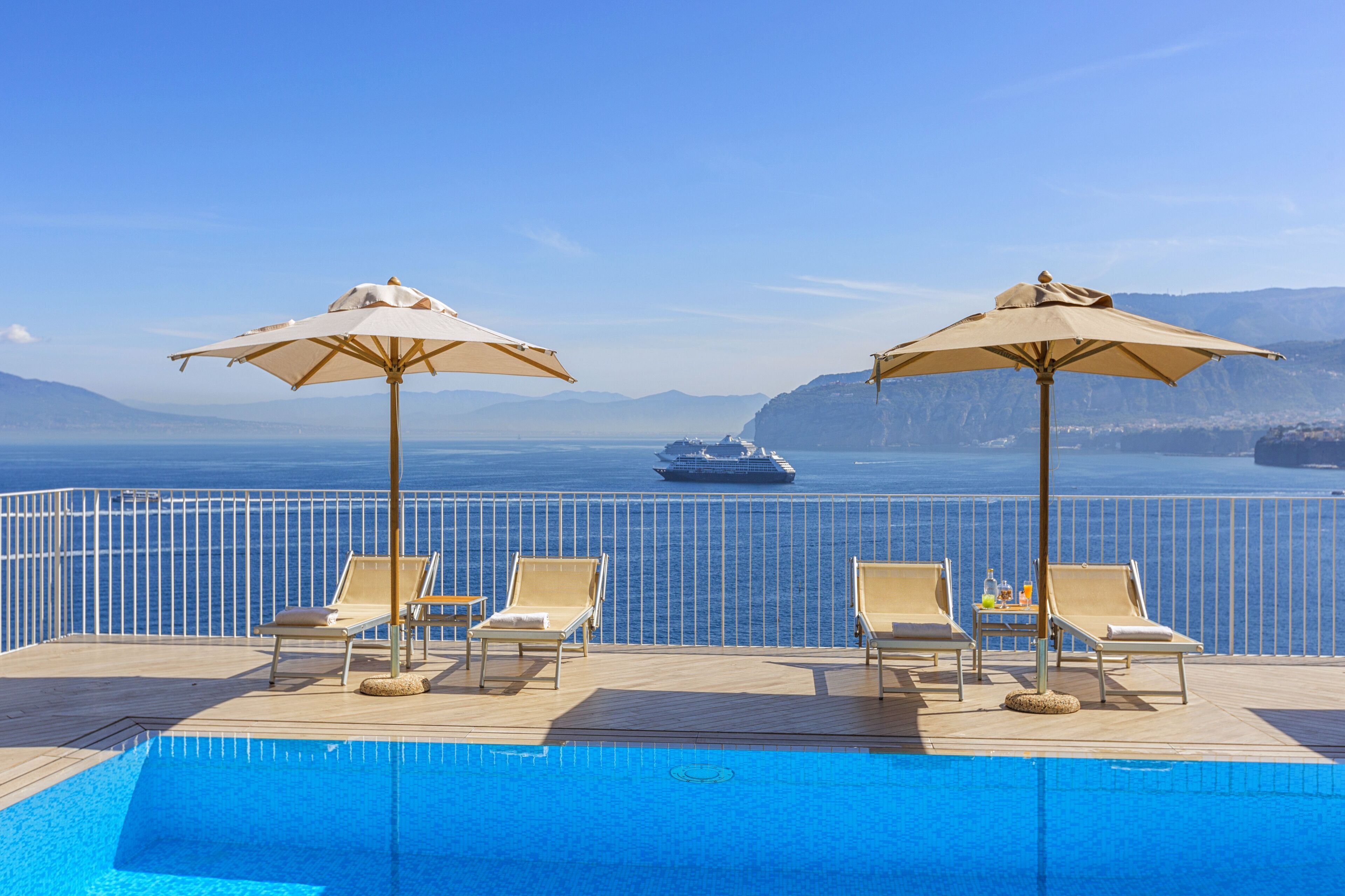 outdoor pool, pool umbrellas, pool loungers