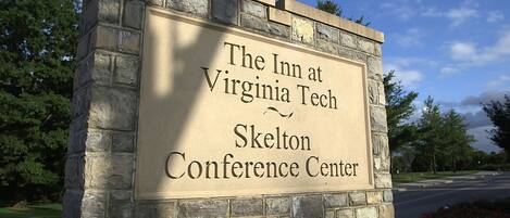 A stone sign with the text "The Inn at Virginia Tech Skelton Conference Center".