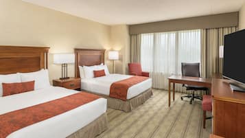 Hypo-allergenic bedding, desk, laptop workspace, blackout drapes