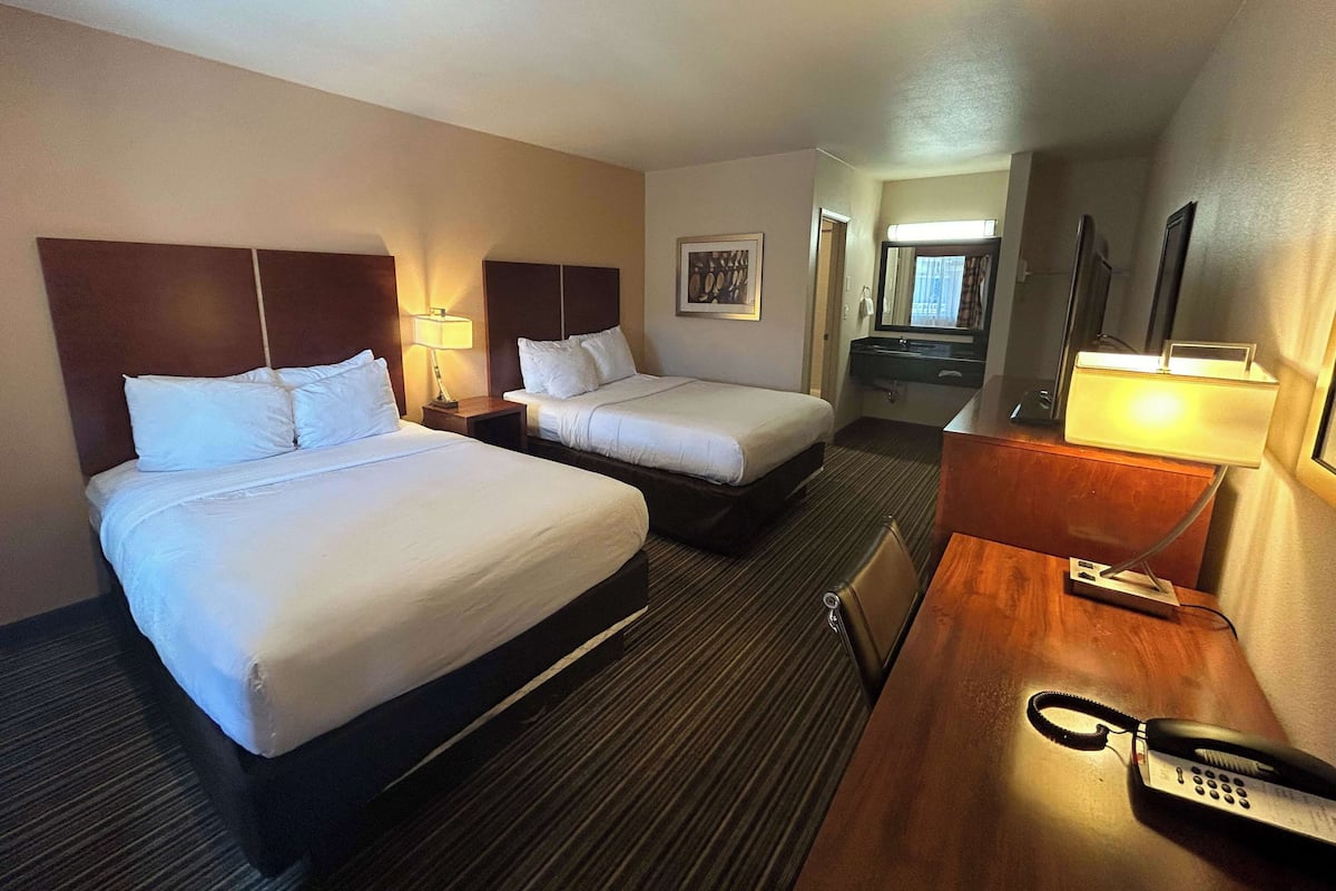 Desk, laptop workspace, blackout drapes, iron/ironing board