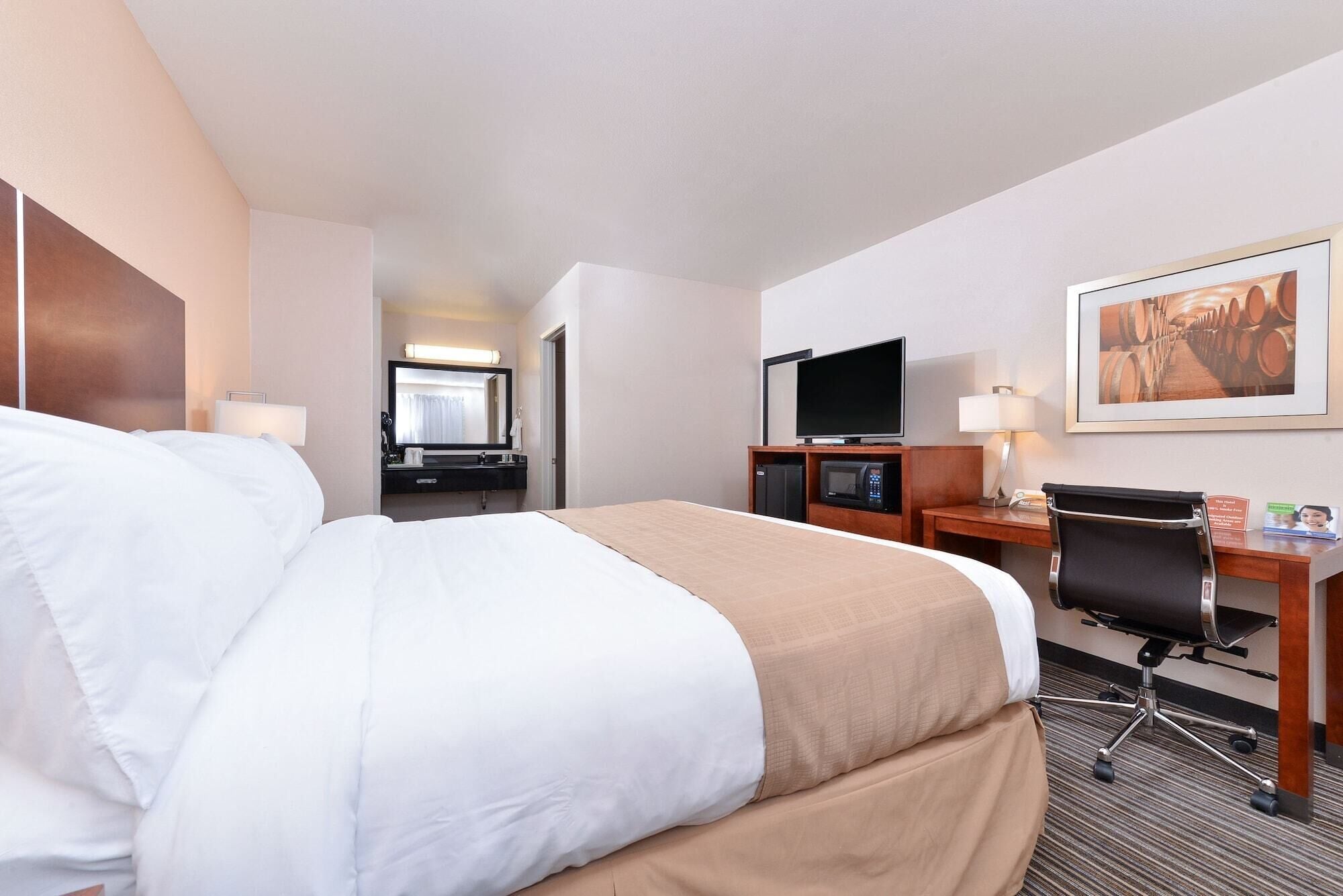 Desk, laptop workspace, blackout drapes, iron/ironing board