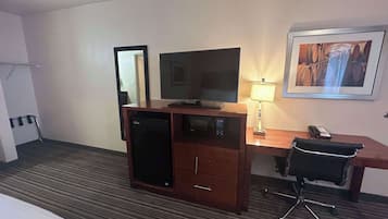 Desk, laptop workspace, blackout drapes, iron/ironing board