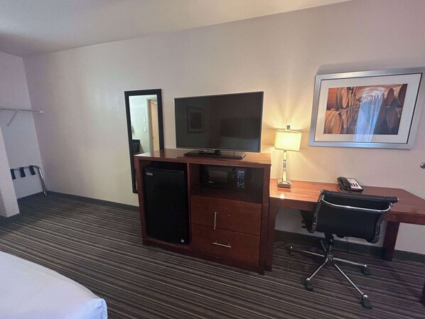 Desk, laptop workspace, blackout drapes, iron/ironing board