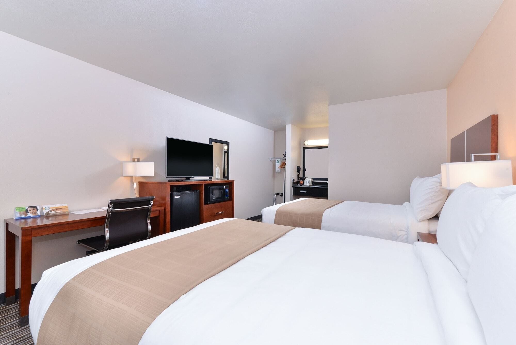 Desk, laptop workspace, blackout drapes, iron/ironing board