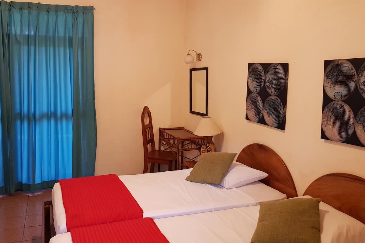 Triple Room, Balcony, Garden View | In-room safe, blackout curtains, free WiFi, bed sheets