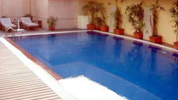 Outdoor pool, open 7:00 AM to 7:00 PM, sun loungers