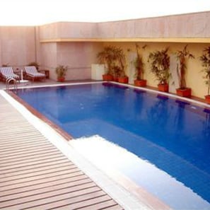 Outdoor pool, open 7:00 AM to 7:00 PM, pool loungers