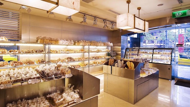 A bakery display with various baked goods and pastries. - San Want Hotel Taipei (Taipei)