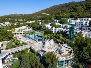 A resort with multiple swimming pools, a bridge, and a variety of buildings. - Blue Dreams Resort-Ultra All Inclusive (Bodrum)
