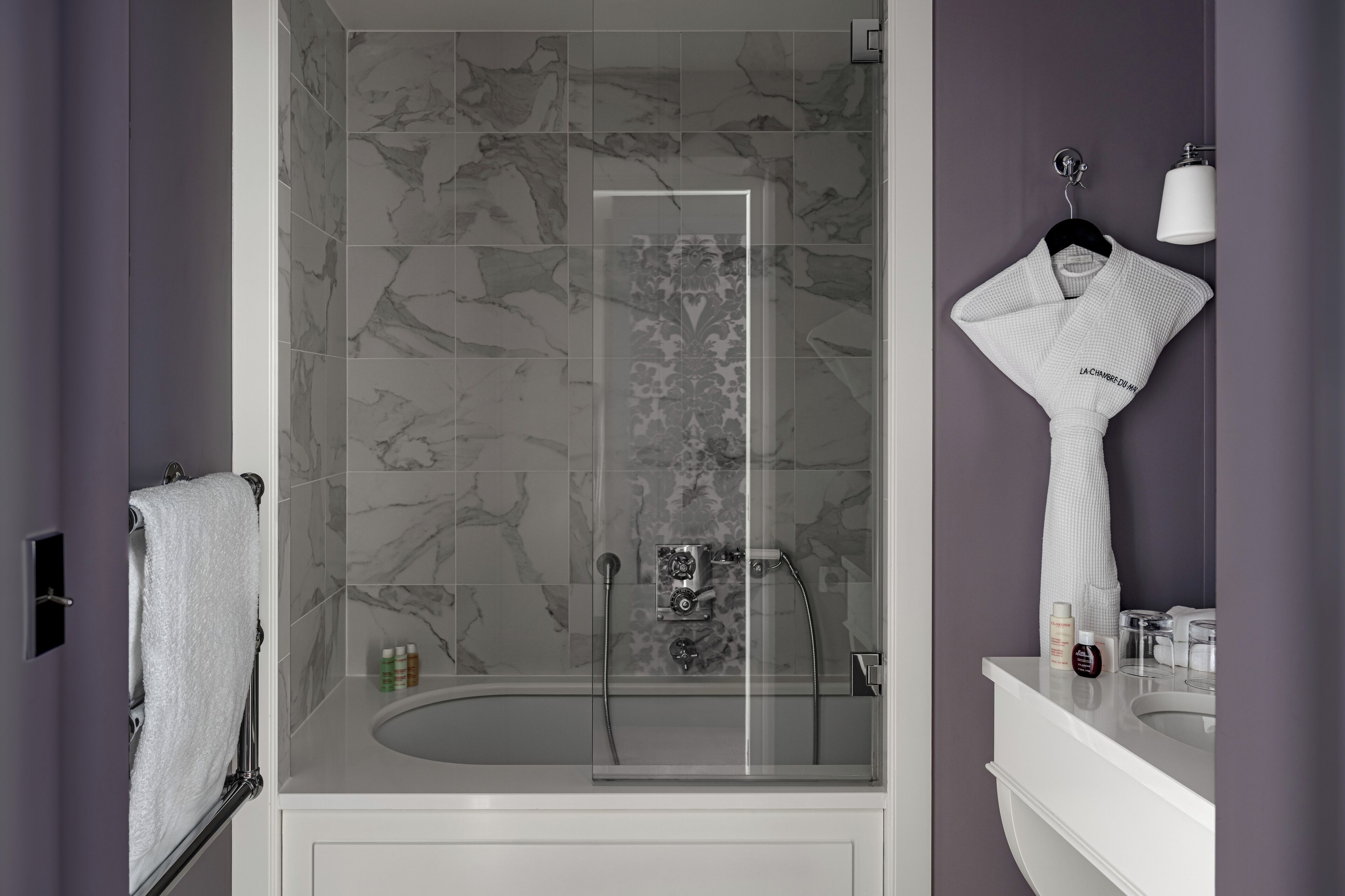 designer toiletries, hair dryer, bathrobes, towels