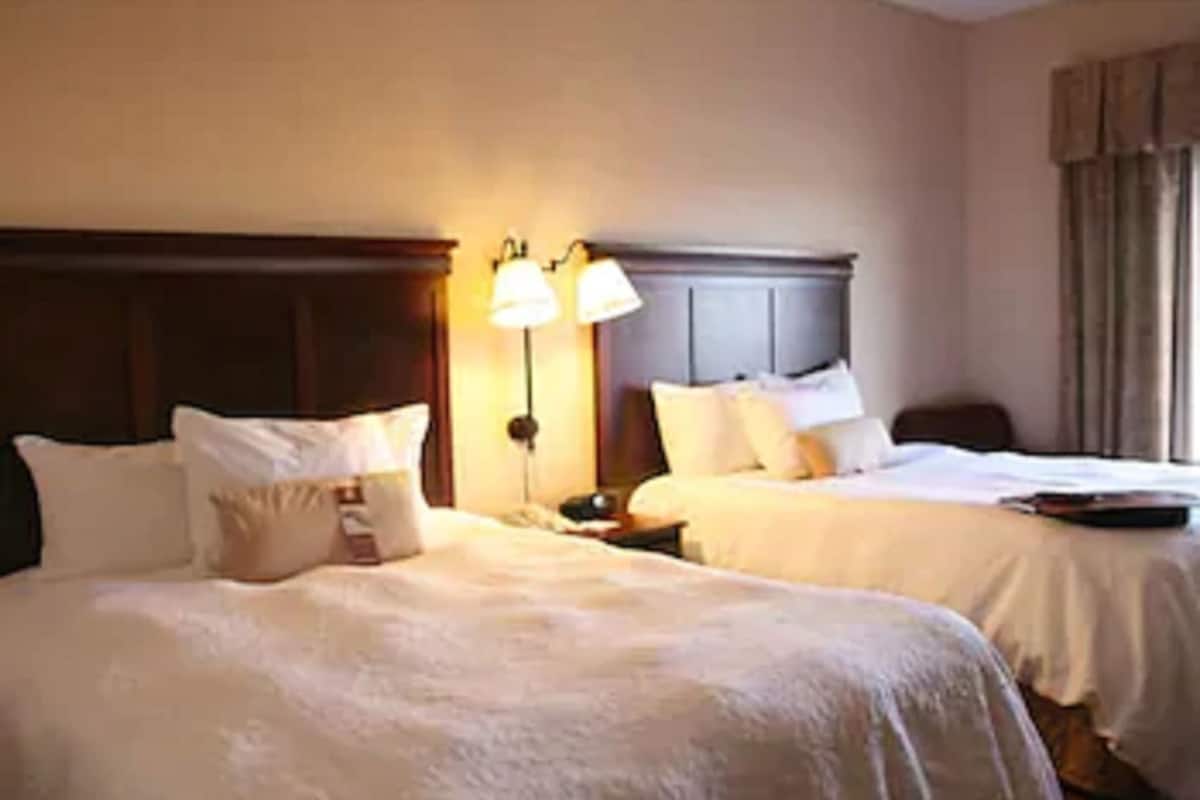 Desk, laptop workspace, iron/ironing board, free cots/infant beds