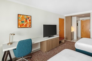 Desk, laptop workspace, blackout drapes, iron/ironing board