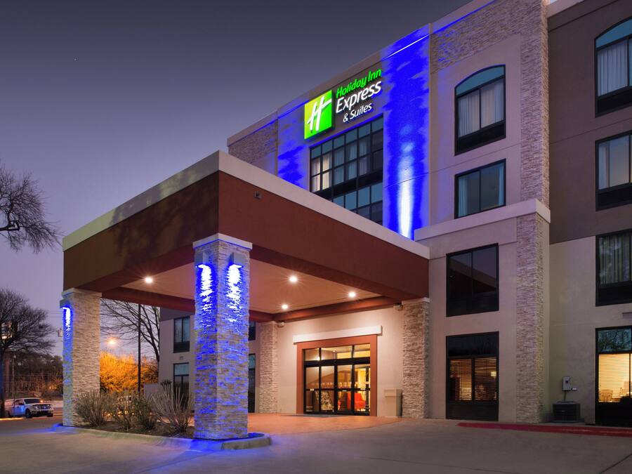 A Holiday Inn Express hotel with a modern facade, large windows, and a prominent entrance.