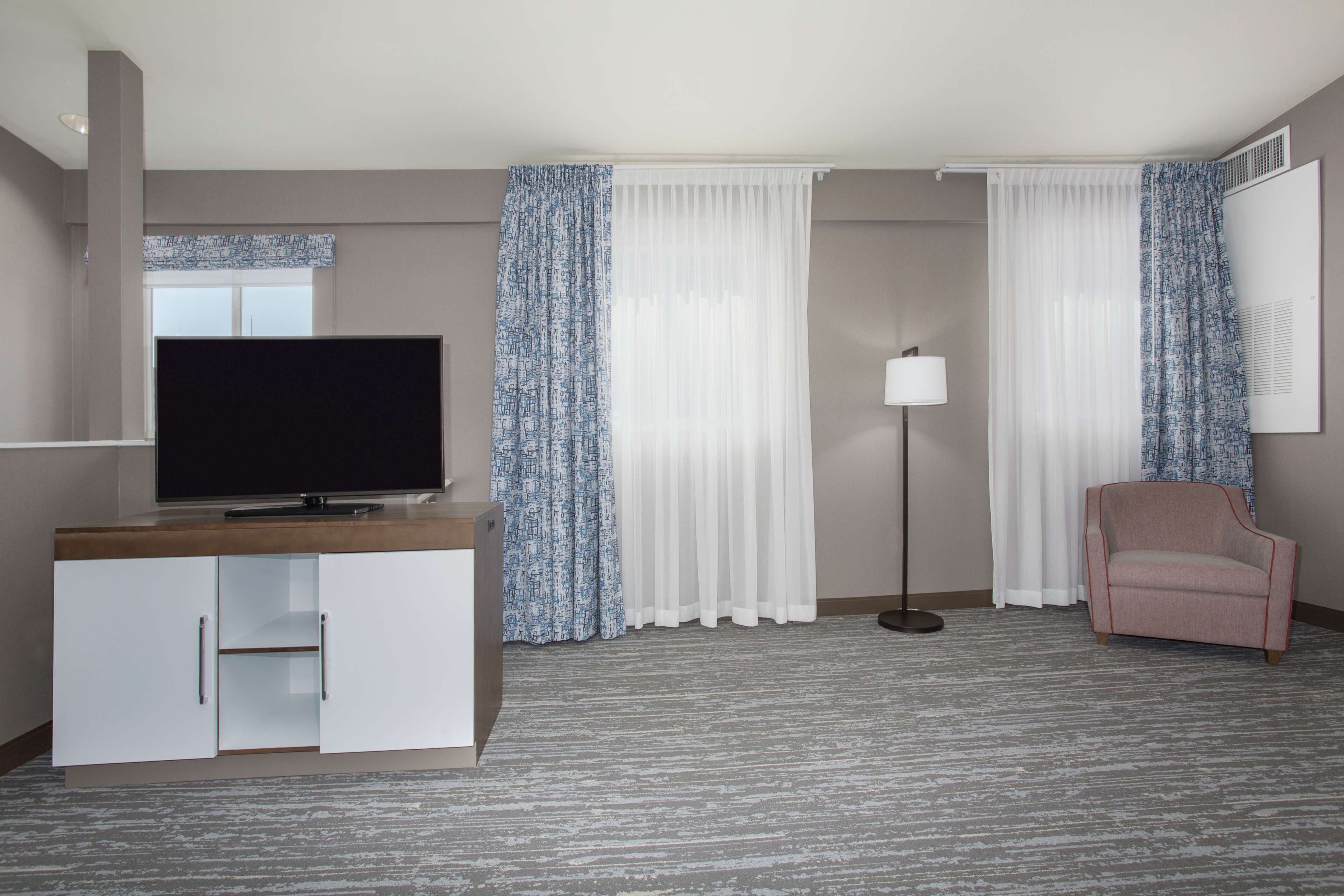 two queen two story suite | pillow-top beds, desk, laptop workspace, blackout curtains