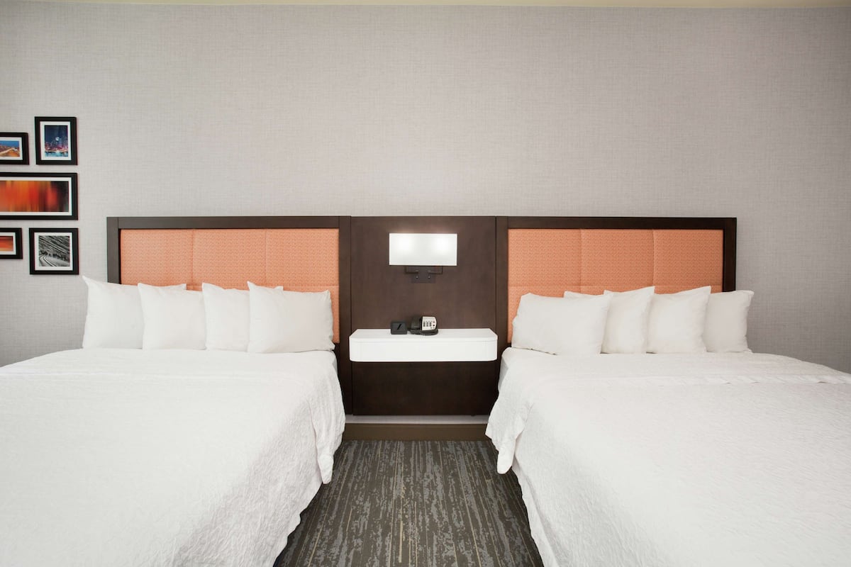 pillow-top beds, desk, laptop workspace, blackout curtains