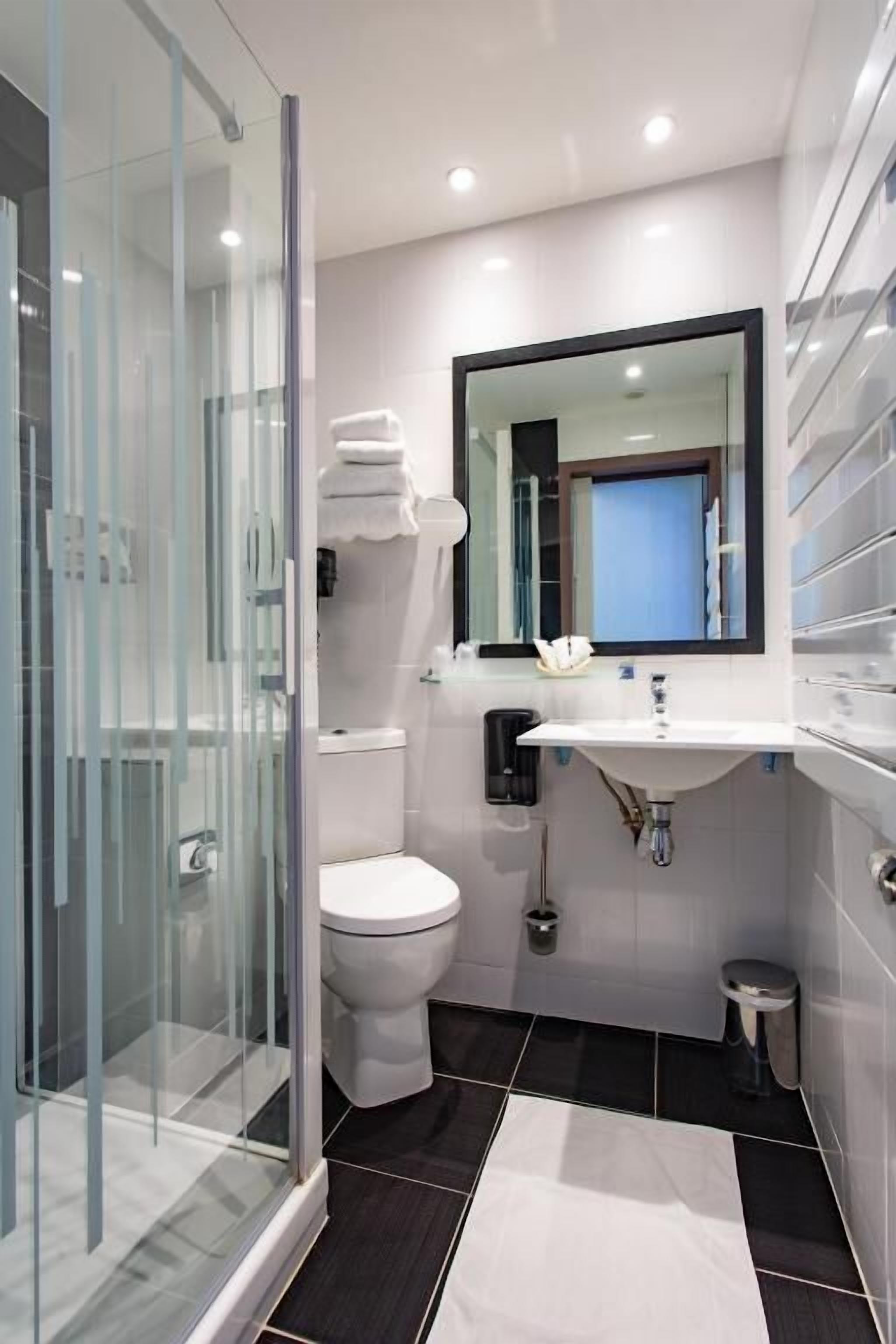 eco-friendly toiletries, hair dryer, towels