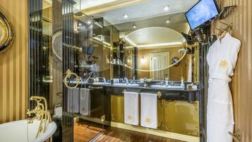 Queen Suite | Bathroom | Designer toiletries, hair dryer, bathrobes, slippers