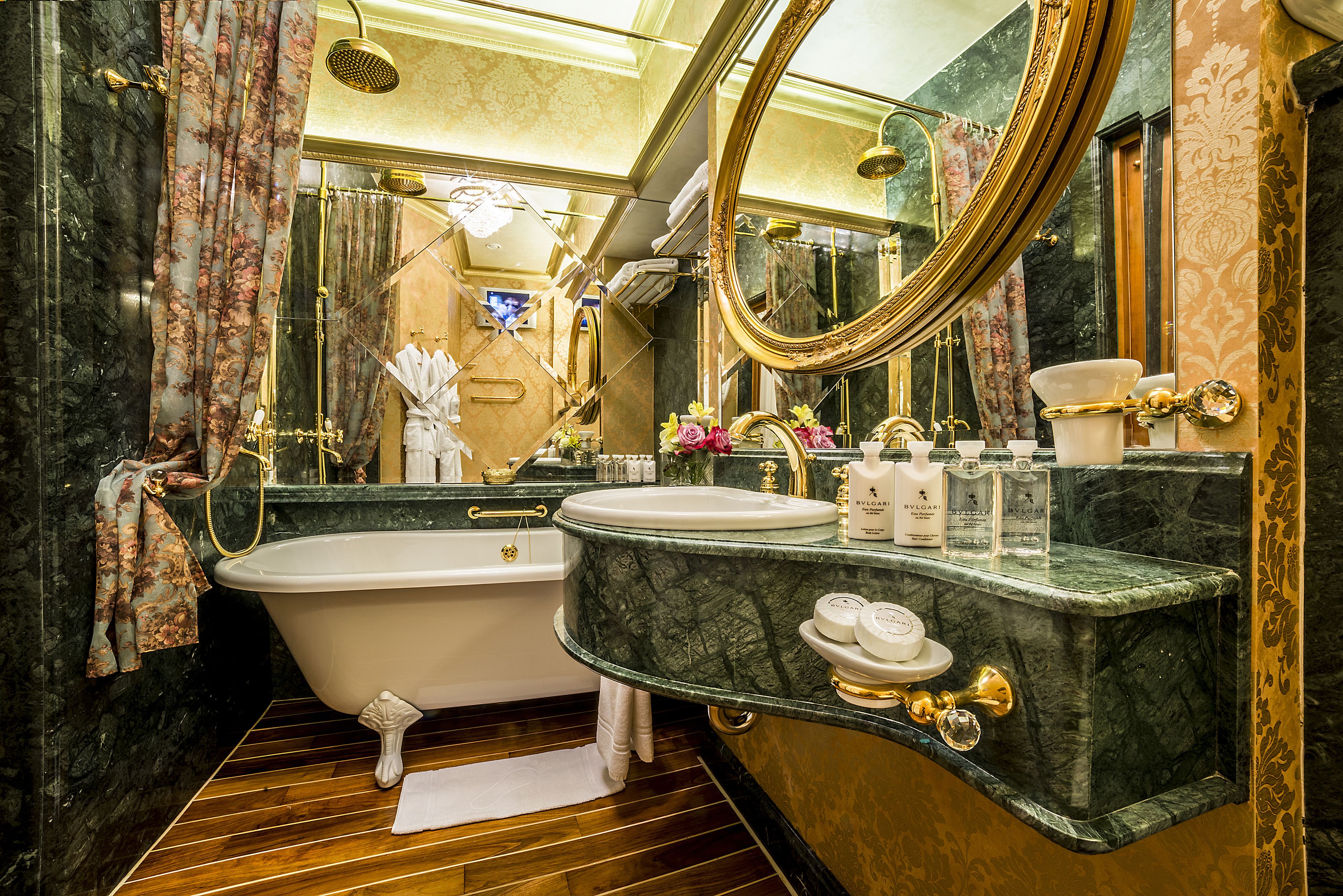 queen suite | bathroom | designer toiletries, hair dryer, bathrobes, slippers