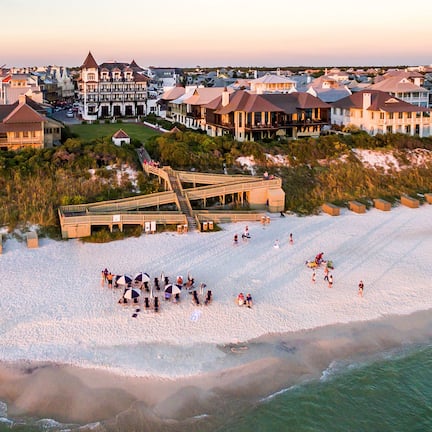 On the beach, white sand, sun loungers, beach umbrellas