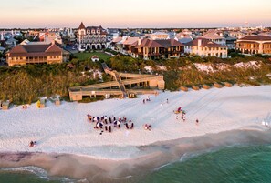 On the beach, white sand, sun loungers, beach umbrellas